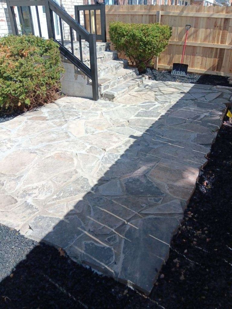After: flagstone paving around the steps.